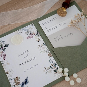 May include: Wedding invitation suite featuring a floral design with the names "Alisa and Patrick" and the date "23. August 2026". Includes a green envelope, wax seal, and a gold wax stamp. The text "Let's Have a Party" is also visible.