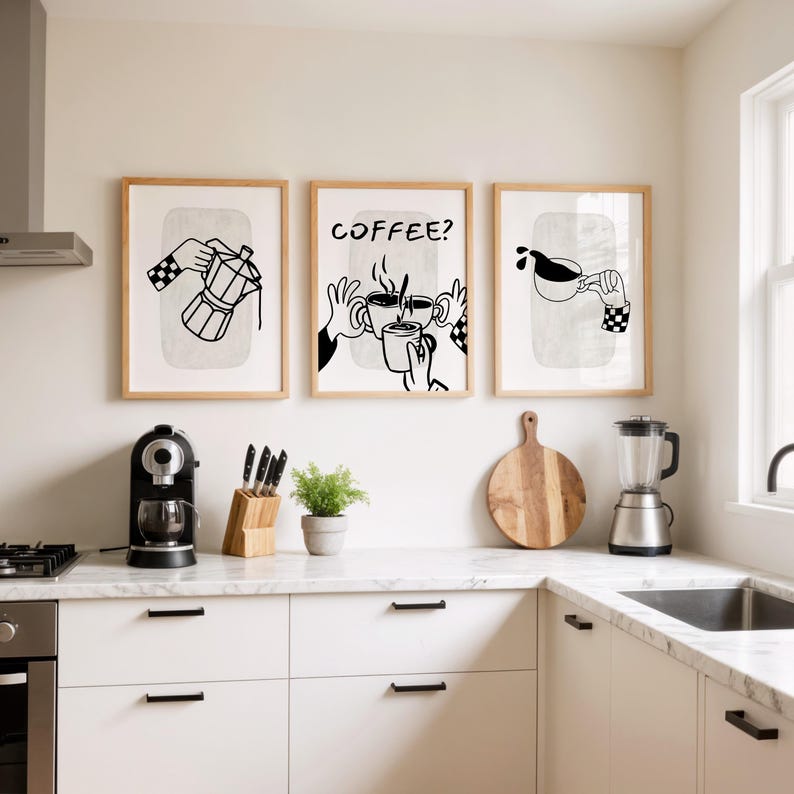May include: Three framed art prints with coffee-themed illustrations. The prints feature black and white line drawings of a coffee maker, hands holding mugs, and pouring coffee. The text "COFFEE?" is in one print. The prints are in a kitchen setting.