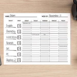 May include: A black and white weekly planner with the name "Adam" at the top. The planner is divided into days of the week, with space for subjects, grades, and assignments. The week of November 11th is highlighted.