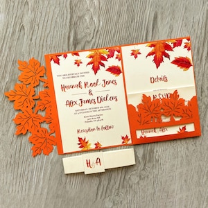 May include: Autumn wedding invitation featuring orange and red leaves. The invitation reads "You are joyfully invited to celebrate the Hannah Rook Jones & Alex James Dickens Saturday, October 9th, 2023 at 4 o'clock in the afternoon Rose Marry Farm 420 Rose Rd Pulaski, TN 38478 Reception to follow"