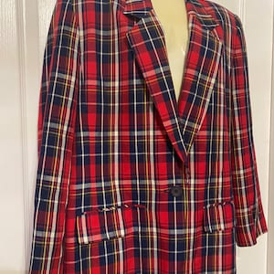May include: A red, blue, and yellow plaid blazer with a single button closure.
