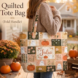 May include: A quilted tote bag featuring a patchwork design of pumpkins, ghosts, and floral patterns in autumn colors. The center panel displays the name Julia in cursive script. The bag has two fabric handles and a rectangular quilted construction.