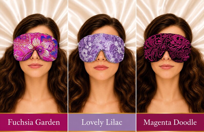 May include: Three sleep masks featuring distinct patterns. The first is a fuchsia and purple floral print labeled Fuchsia Garden. The second is a light purple floral print labeled Lovely Lilac. The third is a black and magenta swirl print labeled Magenta Doodle.