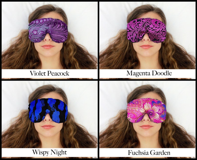 May include: Four sleep masks with various patterns and colours are shown. The masks are labelled "Violet Peacock", "Magenta Doodle", "Wispy Night", and "Fuchsia Garden". Each mask covers the eyes of a person.