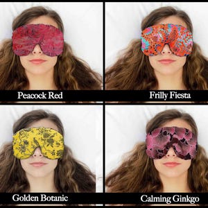 May include: Four patterned eye masks are shown, each covering the eyes of a person. The masks are labelled "Peacock Red", "Frilly Fiesta", "Golden Botanic", and "Calming Ginkgo". The masks feature various colours and designs for sleep or relaxation.