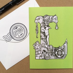 Letra del alfabeto ilustrada a mano L Buscar y encontrar celebración Tarjetas de felicitación