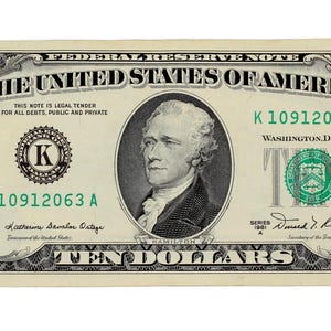 May include: A ten-dollar bill from the United States. The note features a portrait of Alexander Hamilton and the text "The United States of America." The bill is mainly green and black, with the number "10" in each corner.