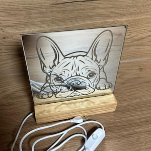 May include: A rustic wooden sign with the text "Welcome to our home" in white lettering. The sign features a distressed finish and a simple, inviting design, perfect for front door decor.