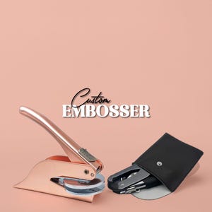 May include: A rose gold custom embosser with a black leather carrying case. The embosser has a handle and a round seal. The text "Custom Embosser" is written in black on a pink background.