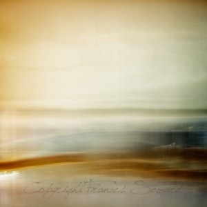 May include: Abstract landscape art print with a blurred effect. The image features a blend of warm and cool tones, including shades of gold, brown, and blue. The artist's signature, "Copyright Frances Seward", is visible in the bottom right corner.