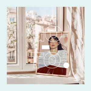 May include: A framed illustration of a woman with long dark hair, wearing a striped shirt and a red skirt. The background is a soft pink with abstract shapes. The word "GO TO" is superimposed over the image in white.