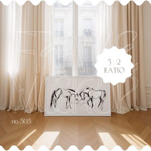 May include: A white frame mockup with a black and white line drawing of two horses. The frame is sitting on a wooden floor with a window and white curtains in the background. The text "3:2 RATIO" is visible in the image.