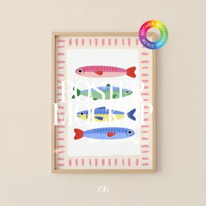 May include: A framed poster featuring four stylized fish illustrations in pink, green, yellow, and blue. The poster has a pink border with a dashed pattern and the text "POSTER MOCKUP" in white. The frame is light brown.