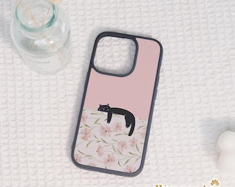 May include: A phone case with a black border and a pink background. The case features a black cat illustration lying on a floral pattern. The bottom right corner displays the text "Wupong Art".