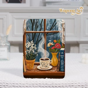 May include: A decorative panel featuring a cozy scene with a steaming cup of coffee on a windowsill. A yellow vase with flowers, a potted plant, and books are also on the sill. The background shows a wintery view through a window.