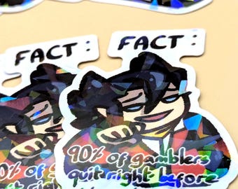 May include: Holographic stickers with a cartoon character and the text "FACT: 90% of gamblers quit right before they hit it big." The stickers have a white border and a colorful, iridescent design.