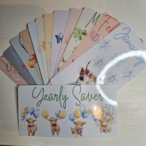 May include: A set of illustrated savings cards and a yearly saver card. The cards display diverse designs, such as floral patterns, butterflies, and Highland cows. The yearly saver card features Highland cows with balloons.