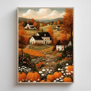 Op de afbeelding: Een ingelijste herfstlandschapsschilderij met witte huizen, oranje pompoenen en herfstbladeren. Het kunstwerk toont een pompoenveld, een kronkelend pad en glooiende heuvels onder een bewolkte hemel.
