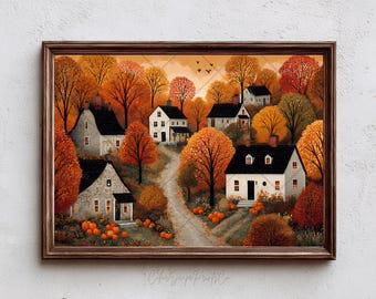 May include: A framed autumn landscape painting featuring a village nestled among trees with vibrant orange and red foliage. The artwork depicts several houses with black roofs and a winding dirt road. Pumpkins are scattered throughout the scene.