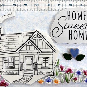May include: A white ceramic mosaic tile kit featuring a black and white outline of a house with a chimney, a brick foundation, and a front porch. The kit also includes a blue heart, green leaves, and various flowers in shades of pink, blue, yellow, and orange. The words "Home Sweet Home" are written in black on a white ceramic tile.