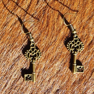 Steampunk/Victorian/Renfair filigree bronze colored key earrings