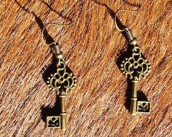 Steampunk/Victorian/Renfair filigree bronze colored key earrings