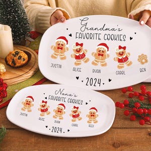May include: Two white oval platters with gingerbread people designs. The top platter reads "Grandma's Favorite Cookies 2024" with names. The bottom platter reads "Nana's Favorite Cookies 2024" with names.