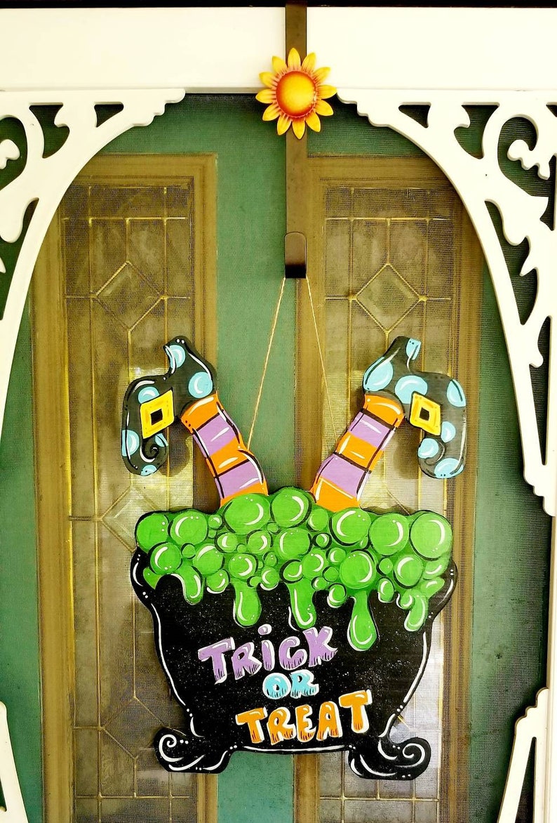 Door hanger for Halloween Witch in cauldron with legs in