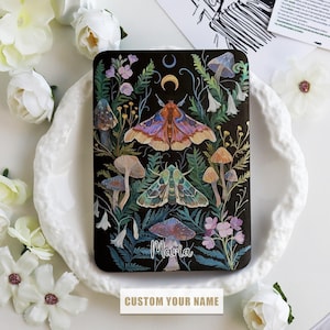 May include: A black background with a colourful illustration of moths, mushrooms, and flowers. The text "Maria" is written in a whimsical font.