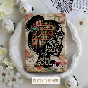 May include: A black silhouette of a woman with flowers in her hair standing in a library. The text reads "& Into the library she goes to lose her MIND and find her SOUL Maria".