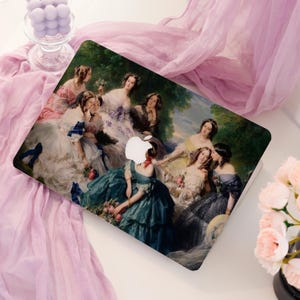 May include: A laptop case featuring a classical painting of women in elegant gowns. The artwork depicts a group of women in a garden setting, with a variety of dress colors including teal, pink, and white. The Apple logo is visible.