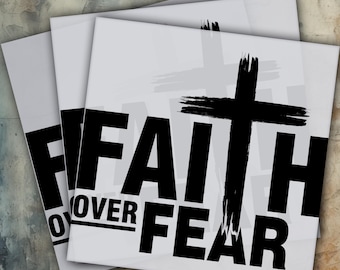 May include: A stack of white heat transfer sheets with the words "FAITH OVER FEAR" in large black letters and a black cross. The text "HEAT PRESS" and "DTF READY TO PRESS" are in yellow and black.