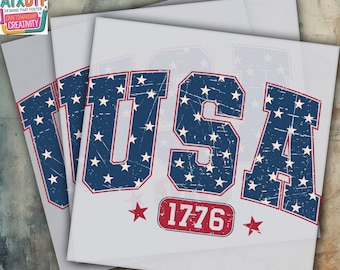 May include: A heat press transfer design featuring the word "USA" in a blue and white distressed font with red stars. The design also includes the year "1776" in a red rectangle.
