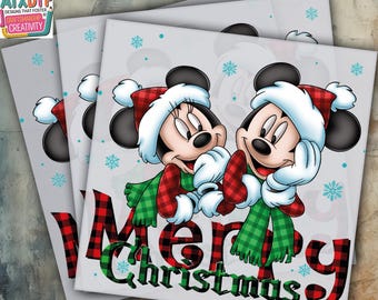 May include: A digital transfer design featuring Mickey and Minnie Mouse dressed in red and green plaid with Santa hats. The design says "Merry Christmas" in a red and green plaid font. The design is ready to be pressed onto a t-shirt or other fabric.