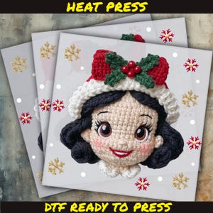 May include: DTF ready to press image featuring a crocheted Snow White design wearing a Christmas hat. The image has a white background with gold and red snowflakes. The text "HEAT PRESS" and "DTF READY TO PRESS" are displayed.