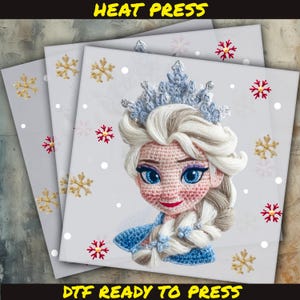 May include: A DTF (Direct to Film) heat press transfer featuring a crocheted Elsa from Frozen. The design shows Elsa's face with a blue crown, blonde braid, and blue dress. The background is light gray with snowflake and dot patterns.