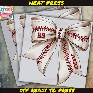 May include: A stack of DTF (Direct to Film) transfers featuring a baseball bow design. The bow is white with red stitching and the number 29. The name "JENSEN" is printed on the bow. The text "HEAT PRESS" and "DTF READY TO PRESS" are also visible.