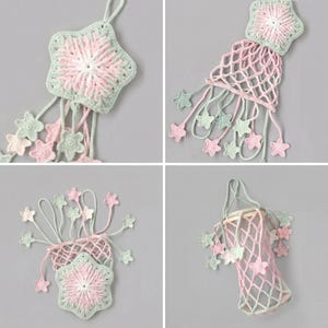 May include: Handmade crochet star ornaments in pastel colors. Each ornament features a star shape with a central design and dangling star accents. The color palette includes shades of pink, green, and white, creating a soft, whimsical aesthetic.