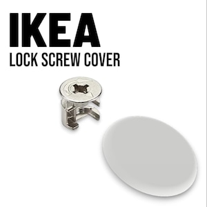 以下が含まれることがあります： IKEAのロックネジカバーセット。画像には、金属製のロックネジと白い楕円形のカバーが写っています。「IKEA LOCK SCREW COVER」というテキストが黒の太字で表示されています。