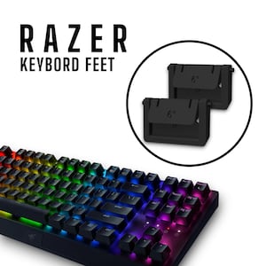 Könnte beinhalten: Eine schwarze Razer-Tastatur mit regenbogenfarbenen Tasten. Das Bild zeigt auch zwei schwarze Tastaturfüße mit einem Winkel von 6 Grad. Der Text "RAZER KEYBORD FEET" wird oben im Bild angezeigt.