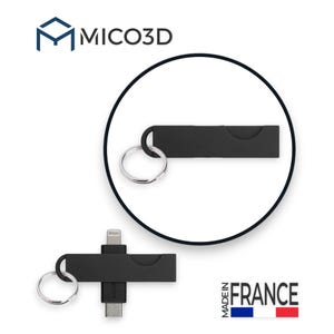 May include: A black rectangular keychain with a silver metal ring. The device features a retractable connector, showing a lightning port on one end and a USB-C port on the other. The text MICO3D and MADE IN FRANCE are visible in the image.