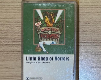 Álbum original del reparto de La pequeña tienda de los horrores en casete - Banda sonora de película de terror