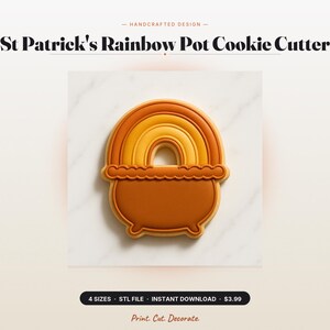 May include: A cookie cutter shaped like a pot with a rainbow arching over the top. The design features a solid brown pot base with a scalloped rim and a multi-layered rainbow in shades of orange and yellow. Text reads St Patrick's Rainbow Pot Cookie Cutter.