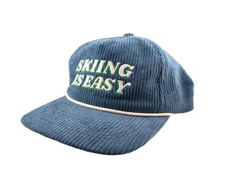 El gorro de pana "Esquiar es fácil" (azul)