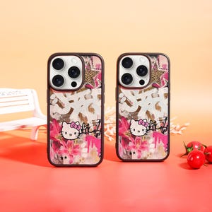以下が含まれることがあります： 茶色の縁取りの2つの携帯電話ケース。ハローキティのキャラクター、ピンクの花、白いグラフィティ風のテキストのデザインが特徴です。上部にはヒョウ柄の星があります。