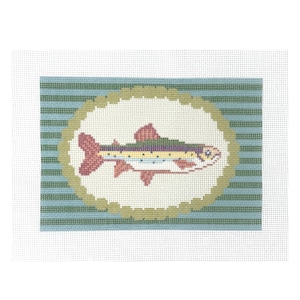 May include: Needlepoint canvas featuring a colorful fish design. The fish is depicted in shades of red, yellow, green, and blue, set against a white oval. The oval is framed by a scalloped border, all on a striped blue and green background.