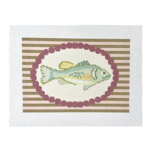 May include: Needlepoint canvas with a fish design. The fish is light blue, yellow, and white, set within a maroon oval border. The background has horizontal stripes in shades of pink and brown, all on a white canvas.