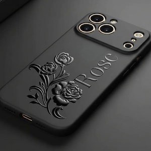 May include: Black phone case with a raised rose design and the word "Rose" embossed on the side. The case has a camera module with three lenses and a flash. The background is a dark, solid color.