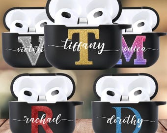 May include: Four black Airpod cases with different coloured glitter letters and names on them. The names are Tiffany, Victoria, Monica, Rachel, and Dorothy.
