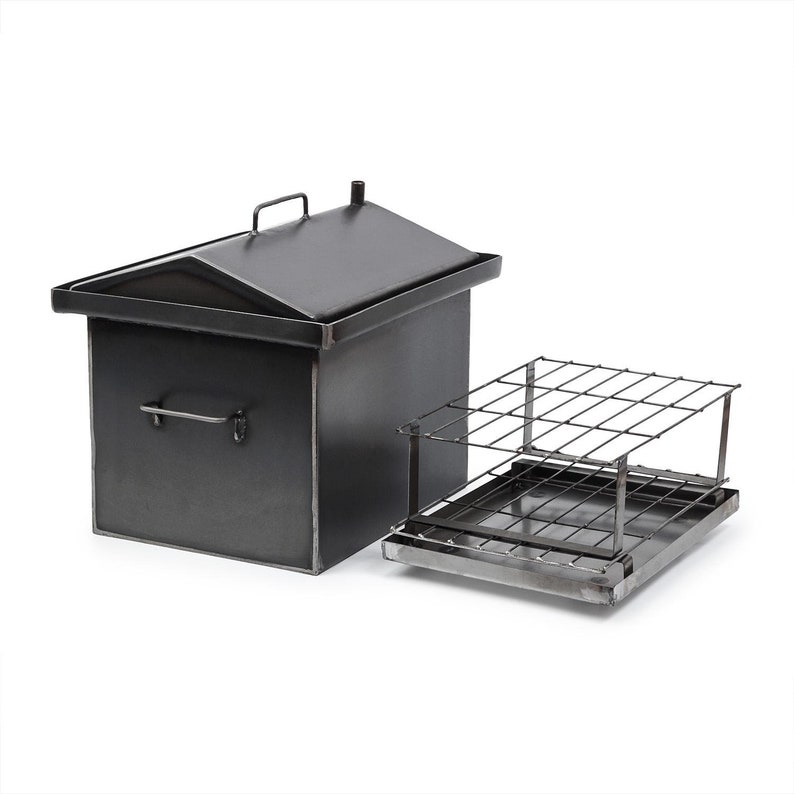 May include: A black metal smoker with a hinged lid and a removable metal grate. The smoker is designed for smoking meats and fish.